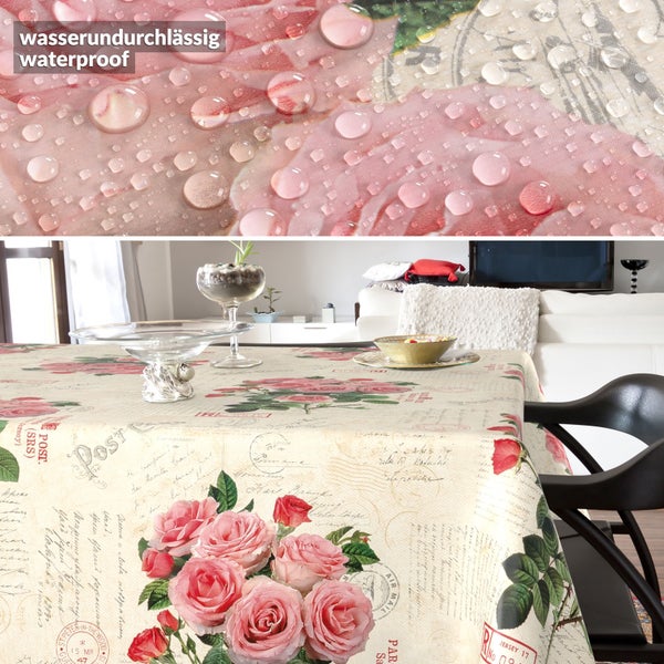 Wasserundurchlässige Tischdecke mit Rosen- und Postkartenmotiv in einem hellen Wohnzimmer.