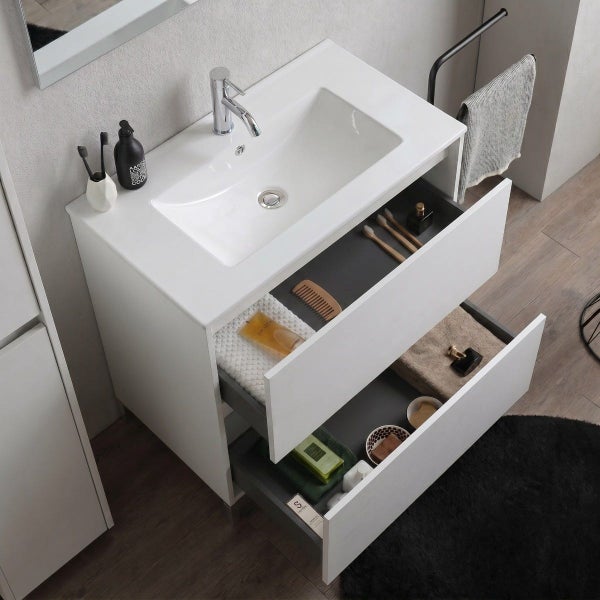 Moderner weißer Waschtischunterschrank mit zwei geöffneten Schubladen, Keramikwaschbecken und verchromter Armatur in hellem Badezimmerdesign.