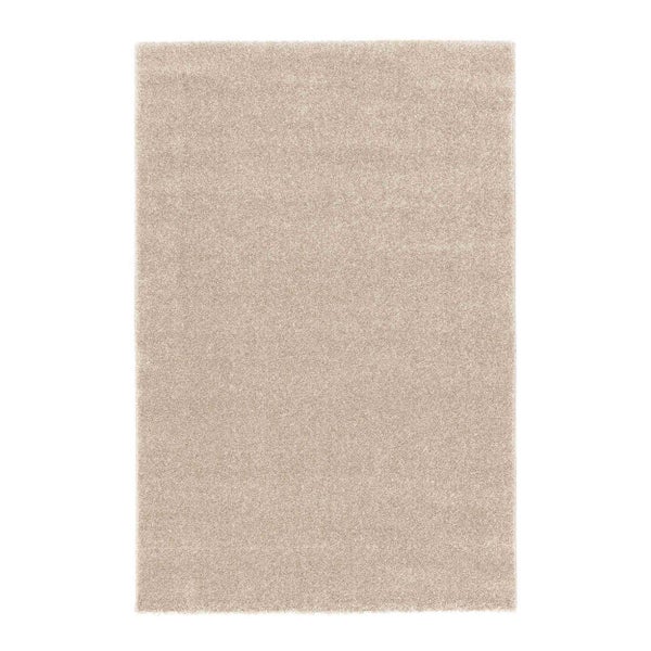 Rechteckiger weicher Hochflor-Teppich in Beige.