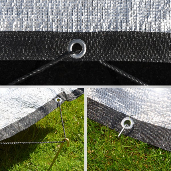 Silbernes Schattiernetz mit verstärktem Rand und Metallösen, befestigt mit Seil und Erdnagel auf Rasen.