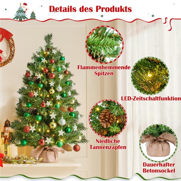 Dekorierter Weihnachtsbaum mit Christbaumkugeln, Sternen und Tannenzapfen auf einem Tisch