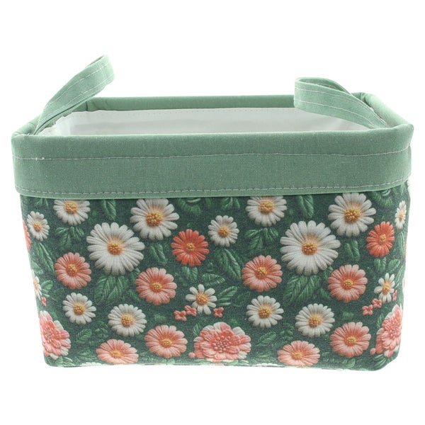 Grüner Aufbewahrungskorb aus Stoff mit Blumenmuster und zwei Tragegriffen.