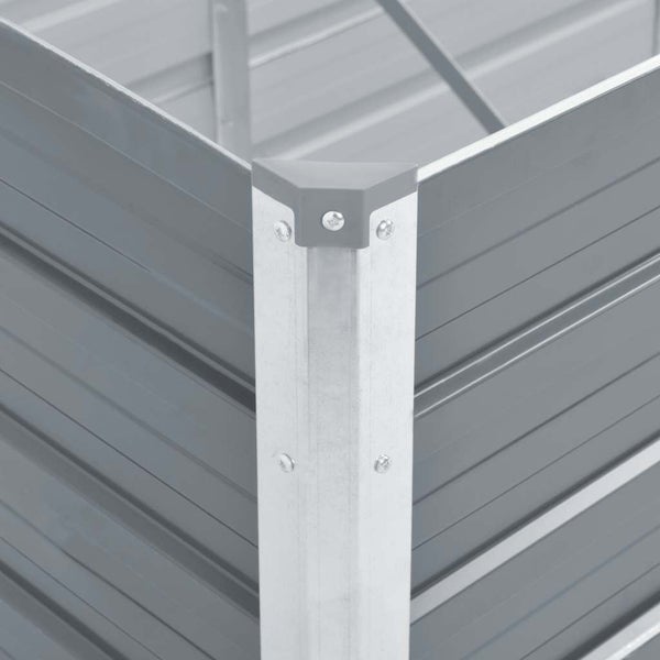 Nahaufnahme der Eckverbindung eines Hochbeets aus Metall mit Wellblechpaneelen und einer Schutzkappe.