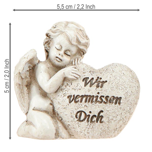 Engel-Figur mit Herz und der Aufschrift 'Wir vermissen Dich', circa 5,5 cm breit und 5 cm hoch