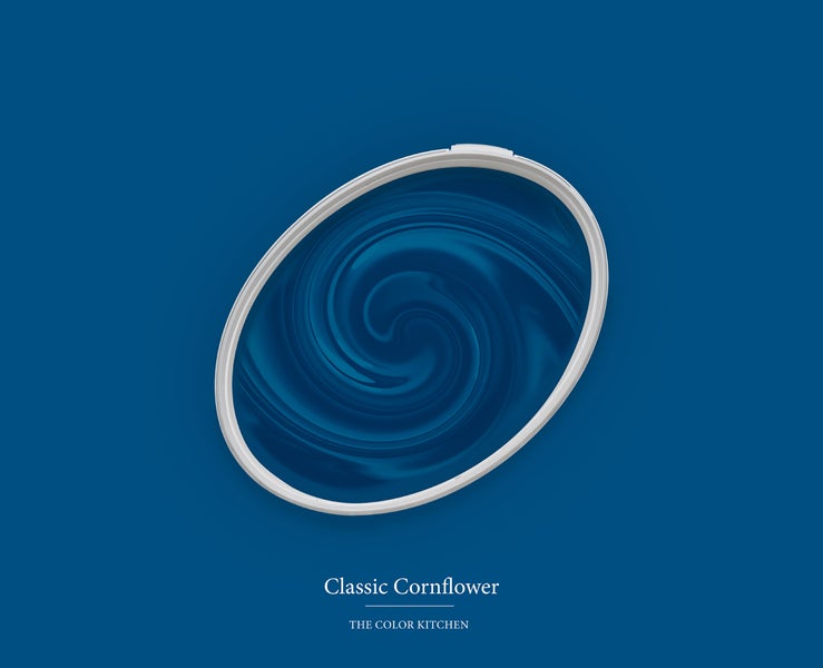 Wandfarbe Classic Cornflower von The Color Kitchen in einem ovalen Behälter mit Farbwirbel.