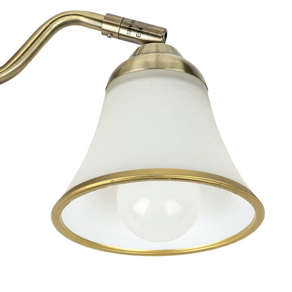 Detailaufnahme einer Wandleuchte mit Lampenschirm aus Glas