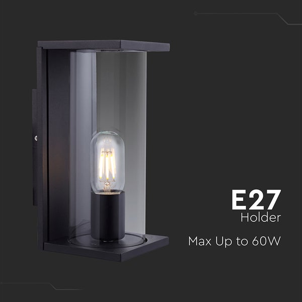 Schwarze Außenwandleuchte mit zylindrischem Glasschirm und E27 Fassung für Leuchtmittel bis maximal 60 Watt.