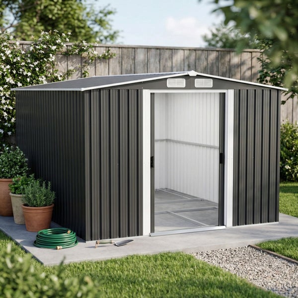 Modernes Gartenhaus aus Metall in Anthrazit mit Satteldach und offenen Schiebetüren auf Betonfundament in einem hellen, organisierten Garten.