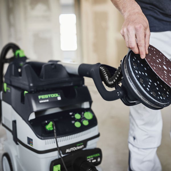 Festool Schleifgerät mit Schleifscheibe und Absaugmobil im Einsatz.