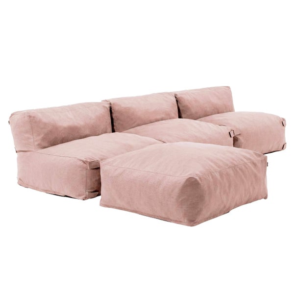 Modulares Sitzsack-Sofa Set in Rosa mit gepolsterten Sitzmodulen und einem Hocker aus strukturiertem Stoff.
