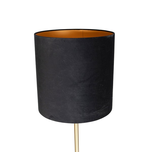 Zylindrischer Lampenschirm aus schwarzem Textil mit goldfarbener Innenseite auf einem schlanken Lampenfuß.