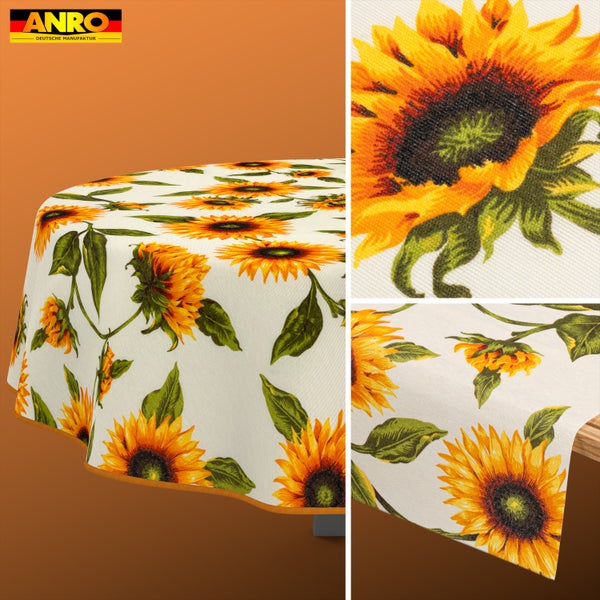 Rundtischdecke mit Sonnenblumenmuster, grünen Blättern und orangefarbenem Rand, Detailansicht der Stoffstruktur und ANRO Logo.