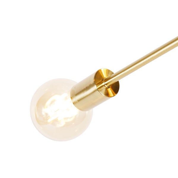 Nahaufnahme einer goldenen Lampe mit Glühbirne