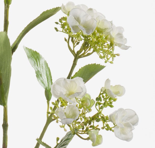 Detailaufnahme von Blatt und Blüte einer künstlichen Lilie aus Kunststoff.