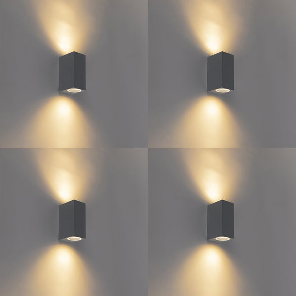 Set aus 4 modernen Wandleuchten in Anthrazit mit Up-and-Down-Lichteffekt an einer Wand.