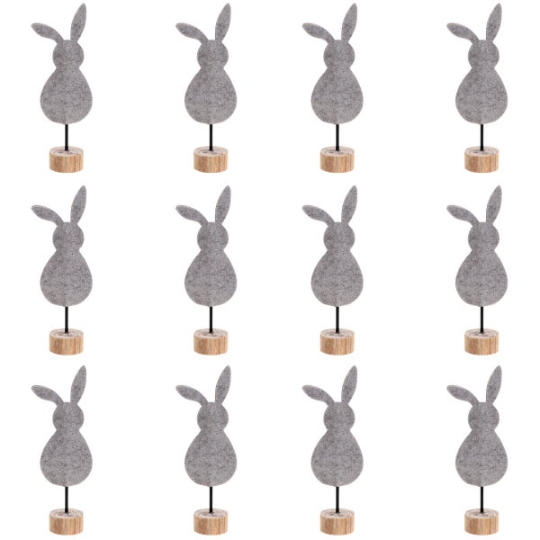 Dekorative Hasenfiguren aus Filz auf Holzsockel, Osterdekoration.