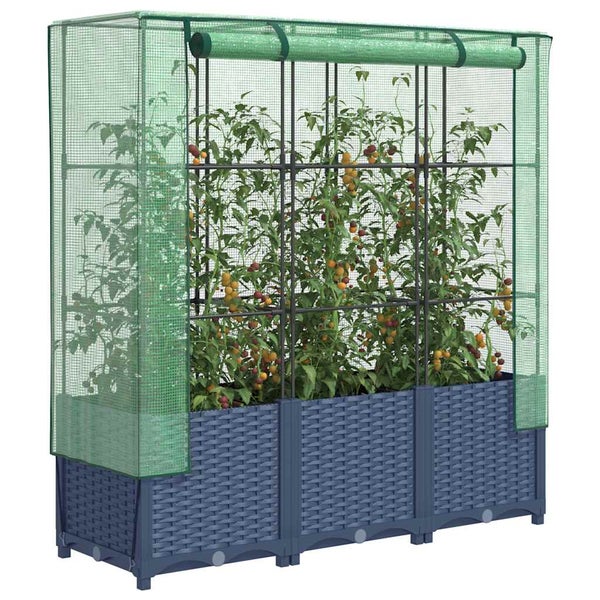 Hochbeet aus Kunststoff in Rattan-Optik mit Gewächshaus-Abdeckung aus grüner Gitterfolie und Tomatenpflanzen im Inneren.