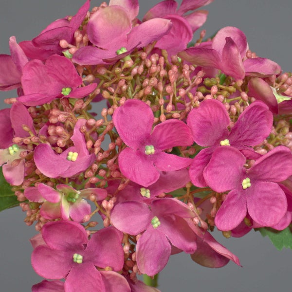 Künstliche Hortensie in Pink mit grünem Stiel und Blatt.