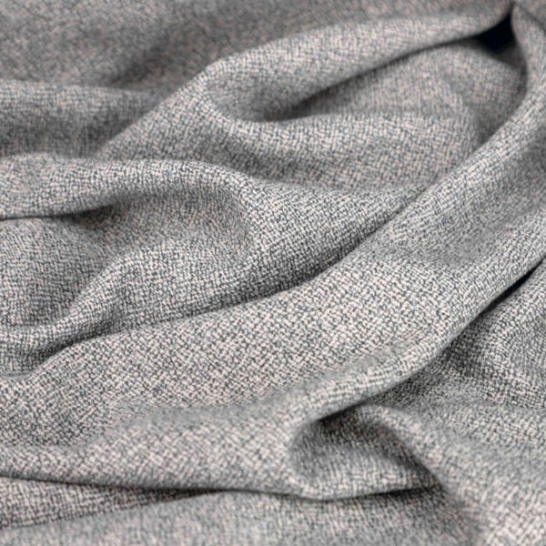 Nahaufnahme von grauem Möbelstoff mit gewebter Textur
