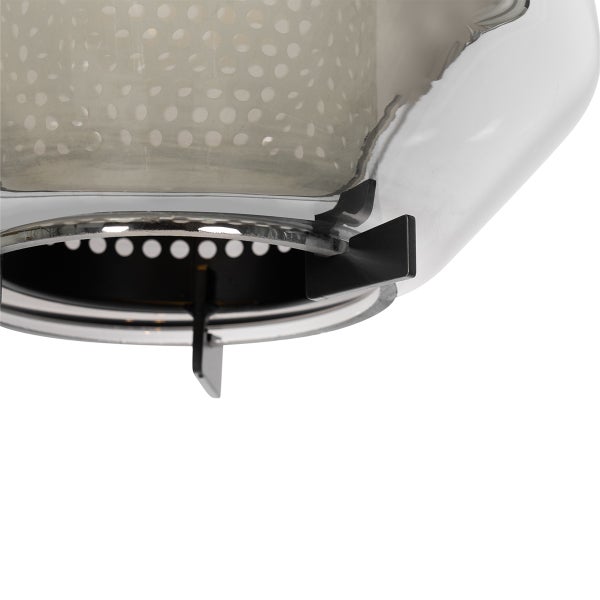 Detailansicht eines Spiritusbrenners mit Halterung und gelochtem Metalleinsatz