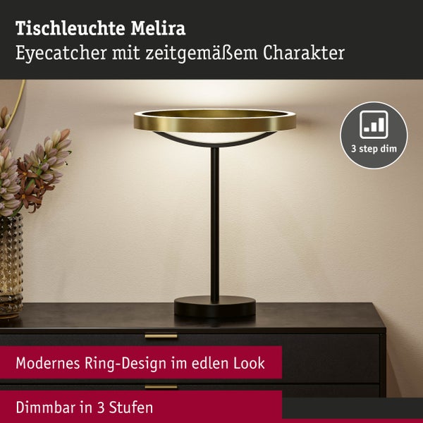 Moderne Tischleuchte Melira mit ringförmigem Kopf in Gold, schwarzem Stab und rundem Standfuß. In drei Stufen dimmbar.