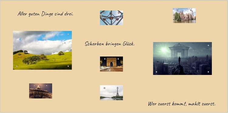 Kollektion von Wandbildern mit Landschaftsaufnahmen, Architekturmotiven und deutschen Sprichwörtern.