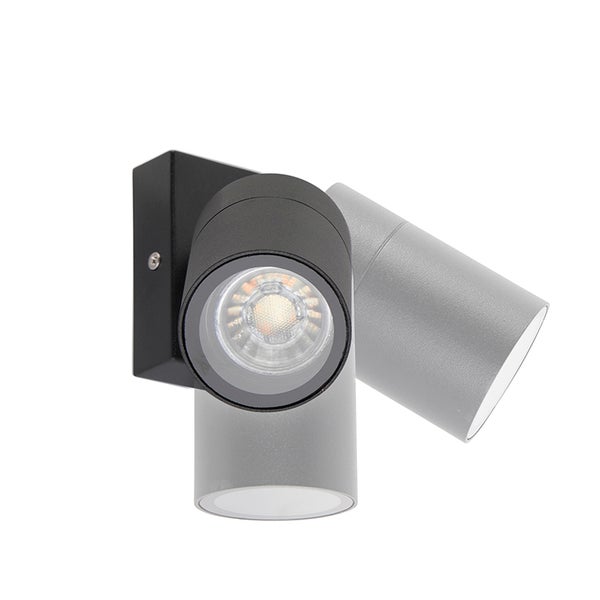 Wandspot mit schwenkbarem, zylinderförmigem Kopf aus Metall.