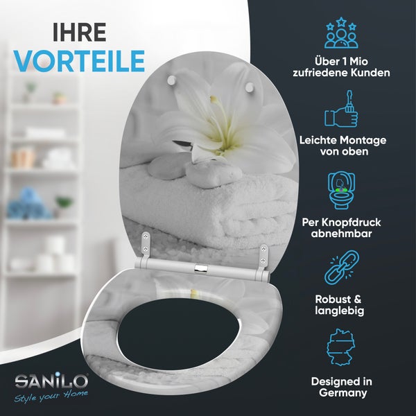 Sanilo Toilettensitz mit Lilien-Motiv. Vorteile: Montage von oben, per Knopfdruck abnehmbar, robust, langlebig und in Deutschland entworfen.
