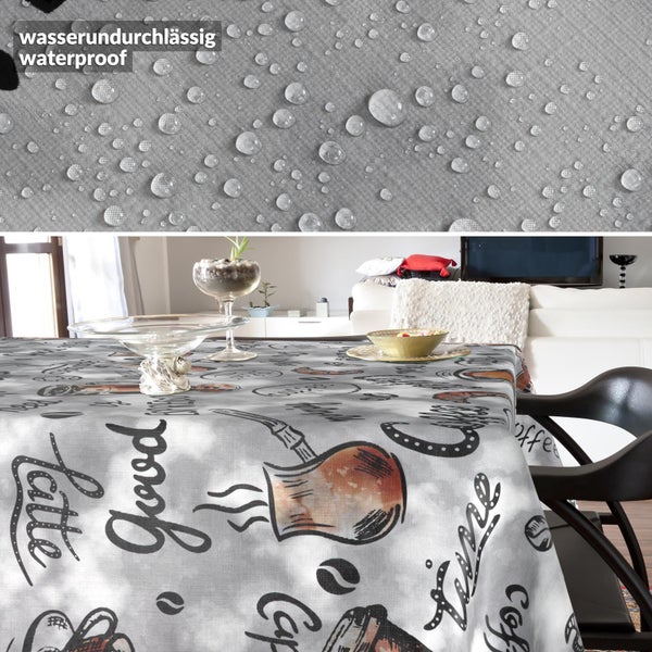 Wasserundurchlässige Tischdecke mit Kaffee-Motiven und Schriftzügen. Die Nahaufnahme zeigt die wasserabweisende Eigenschaft durch Wassertropfen.