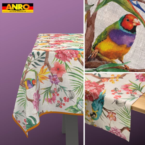 Tischdecke und Tischläufer mit tropischem Motiv aus Vögeln, Blumen und Blättern auf Stoff in Leinenoptik. ANRO Logo.