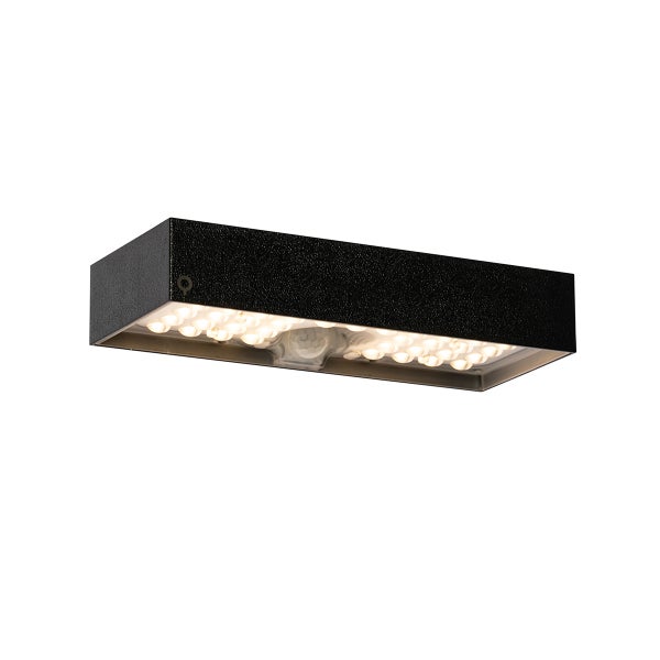 Rechteckige LED-Außenwandleuchte mit Bewegungsmelder, schwarze strukturierte Oberfläche, warmweißes Licht.