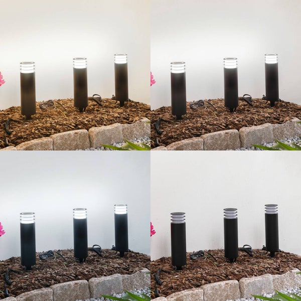 Zylindrische Wegeleuchte in Schwarz mit Erdspieß und Lamellen am Lampenkopf für den Außenbereich.