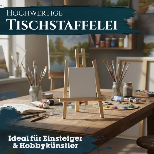 Hölzerne Tischstaffelei mit kleiner weißer Leinwand auf einem Arbeitstisch mit Pinseln, Farbtuben und Palette in einem hellen Künstlerstudio.