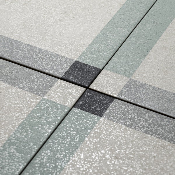Fliese mit Terrazzo Optik in geometrischem Muster mit Linien und Quadraten für den Bodenbelag oder Wandbelag.
