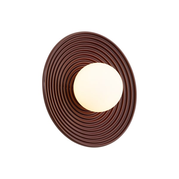 Wandleuchte in runder Form mit Rillenstruktur und einer Lichtkugel als Leuchtmittel.