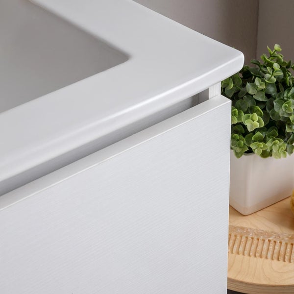 Detailansicht eines weißen Waschtischunterschranks mit Aufsatzwaschbecken