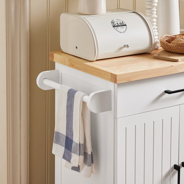 Detailansicht eines Küchenwagens mit Brotkasten, Handtuch und Holzplatte.