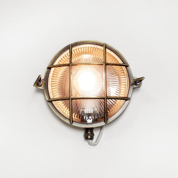 Runde Wandleuchte mit Schutzgitter