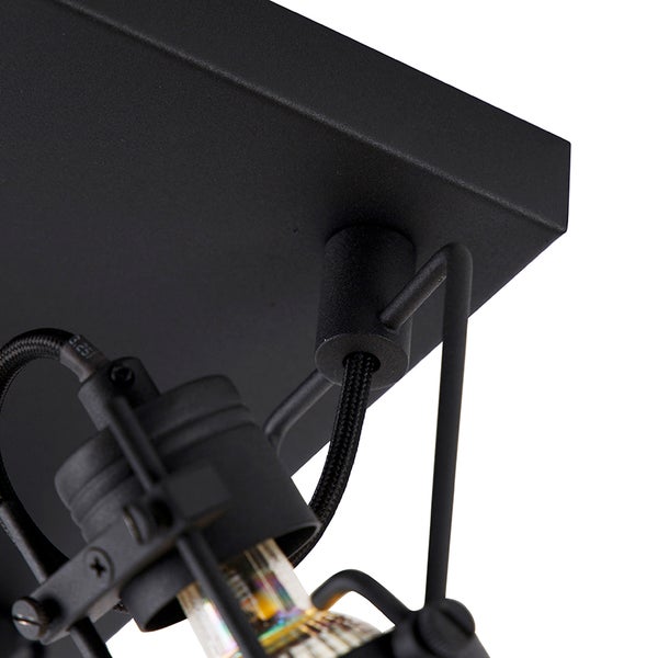 Detailaufnahme einer schwarzen Deckenleuchte mit Spotstrahler