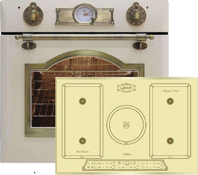 Kaiser Einbauherd und Induktionskochfeld im Vintage Design mit analoger Uhr und messingfarbenen Bedienelementen