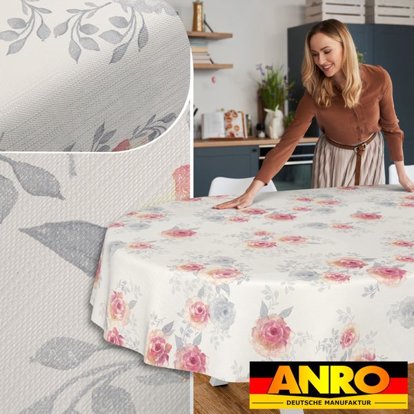 Abwaschbare ovale Wachstischdecke mit floralem Muster aus Rosen und Blättern in einer modernen Küche, ANRO Deutsche Manufaktur Logo.