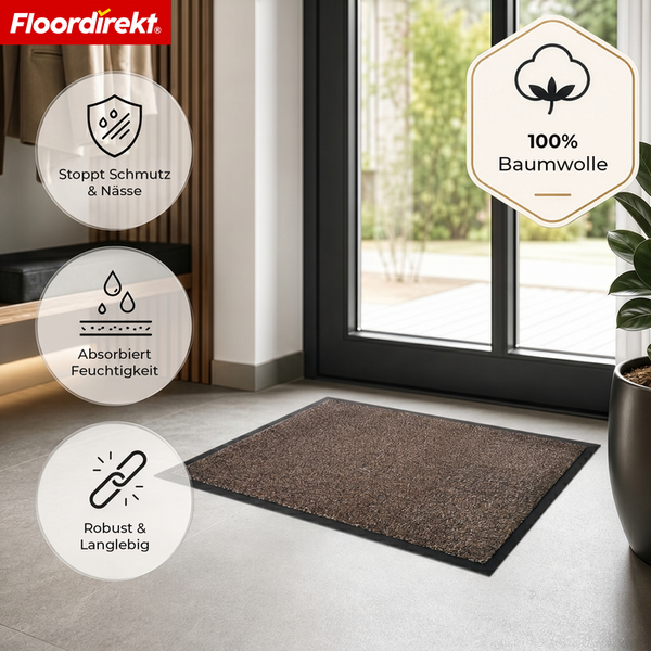 Schmutzfangmatte aus 100 Prozent Baumwolle im hellen Eingangsbereich vor einer Glastür. Floordirekt Logo. Schmutzstopp, saugfähig und langlebig.