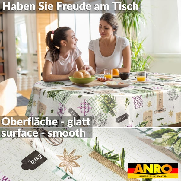 Tischdecke mit Kräutermuster auf einem Esstisch mit Mutter und Tochter beim Essen. ANRO Logo.