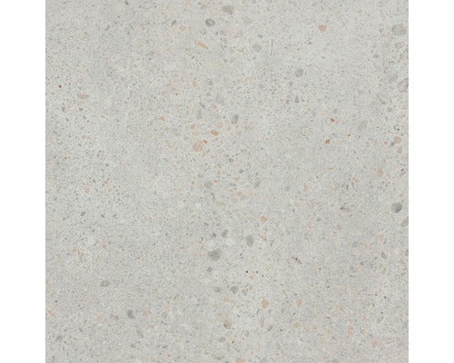 Detailaufnahme einer Feinsteinzeugfliese mit Terrazzo Optik.