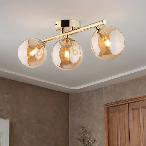 Deckenleuchte mit drei kugelförmigen Glasschirmen