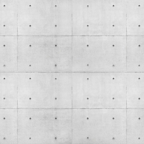 Graue Betonwand mit regelmäßigen Bohrlöchern