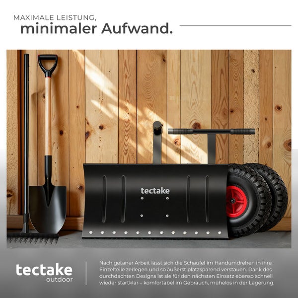 Schneeschaufel, Rechen und Zubehör vor Holzwand