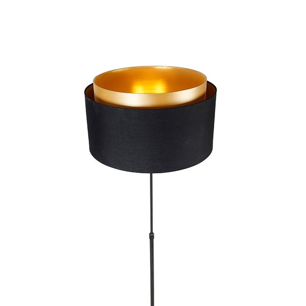 Stehlampe mit schwarzem Lampenschirm und goldenem Reflektor