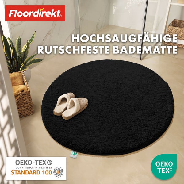 Runde, rutschfeste, saugfähige Badematte aus Textil mit Hausschuhen und Pflanzen im Badezimmer sowie Floor direkt Logo und Oeko-Tex Siegel