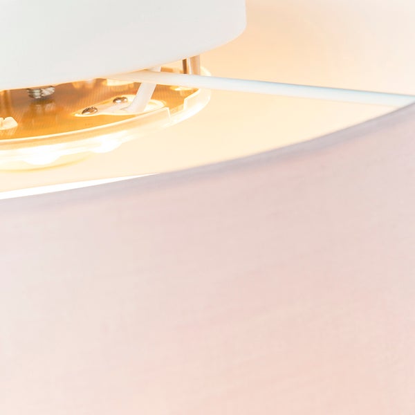 Detailaufnahme des Innenlebens einer Deckenleuchte mit integriertem LED-Modul und Textilschirm.